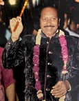 The owner of Manohar Brass Band mastering the band during a live session.