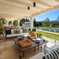 View from the shaded porch across the pool and gardens of Villa La Gratitud