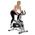 women riding exercise bike