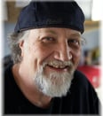 a man with a beard and a hat on