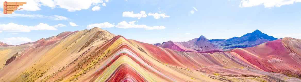 a rainbow - colored mountain in Peru