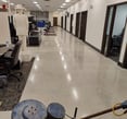 a floor burnisher polishing a concrete floor
