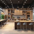 diseno coworking zona social con muebles de madera, mesas altas