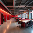 industrial open space with red phonebooths and concrete floor