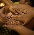 Lady getting a four hands massage