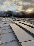 fully installed solar panels on roof with snow