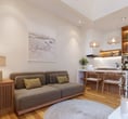 Villa Nila’s cozy living space and fully equipped kitchen, designed for comfort and island living in