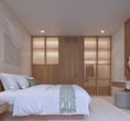 Bed view inside Villa Oraya, combining minimalist design with warm textures and calming Bali vibes