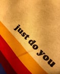 a colorfully coloured sweatshirt with the words just do you