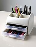a desk organizer and pens, representing a thoughtful affordable gift idea under $30