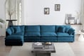 a blue couch with pillows and a coffee table