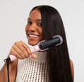 A woman with straight hair using the Tymo Ring