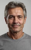 Portrait of a man with a gray shirt and a gray shirt