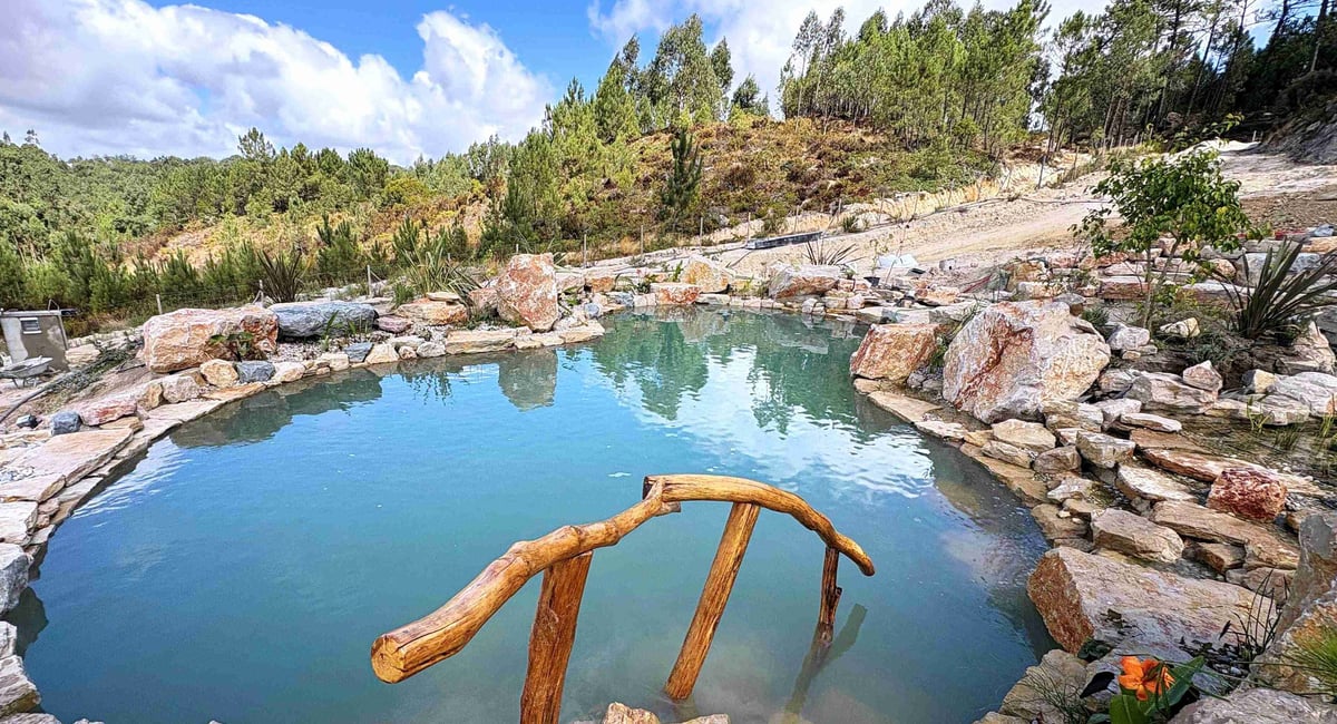 Completed natural swimming pool — clear water, ecological design, Portugal