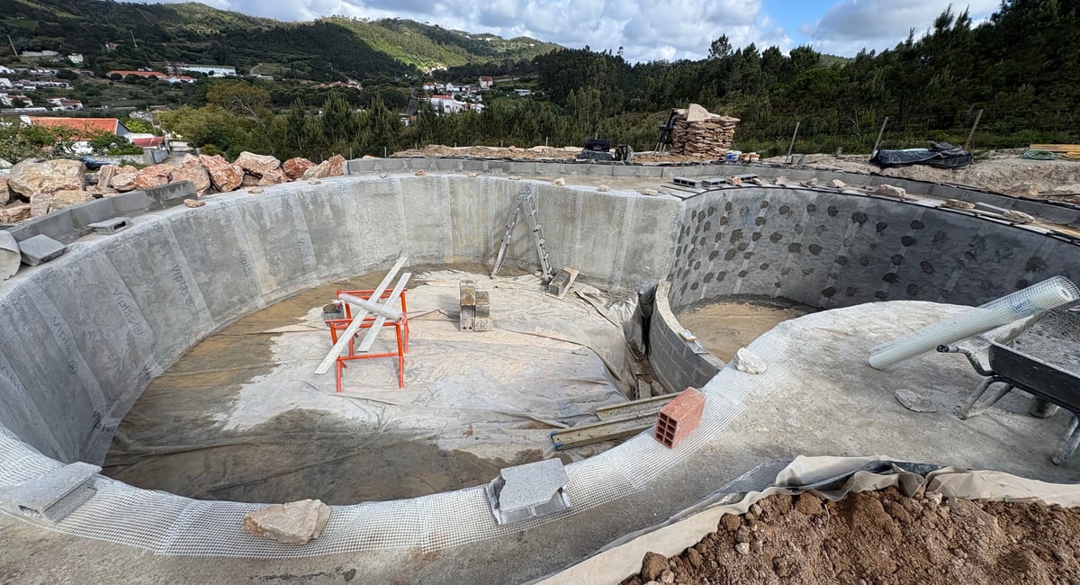 Natural pool construction in progress — reinforced concrete shell, Aqua Vitae Portugal