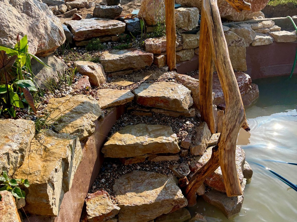 Custom natural timber railing and stone steps — Lisbon Natural Pool Oasis