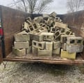 TRAILER OF CONCRETE BRICKS ON RESIDENTIAL CONSTRUCTION CLEANUP SITE