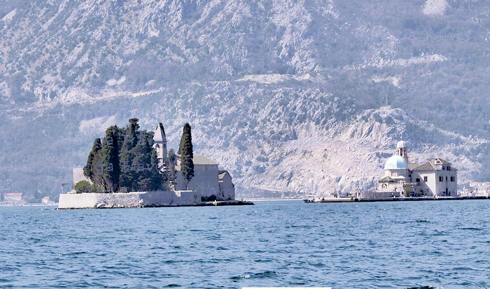 2 magnificent islands of Bay of Kotor: one with a blue cupola & the second with a stone church