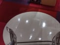 The lights reflecting are 2 stories up.