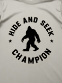 Hide and Seek Champion T-shirt with Bigfoot silhouette, novelty gift for men