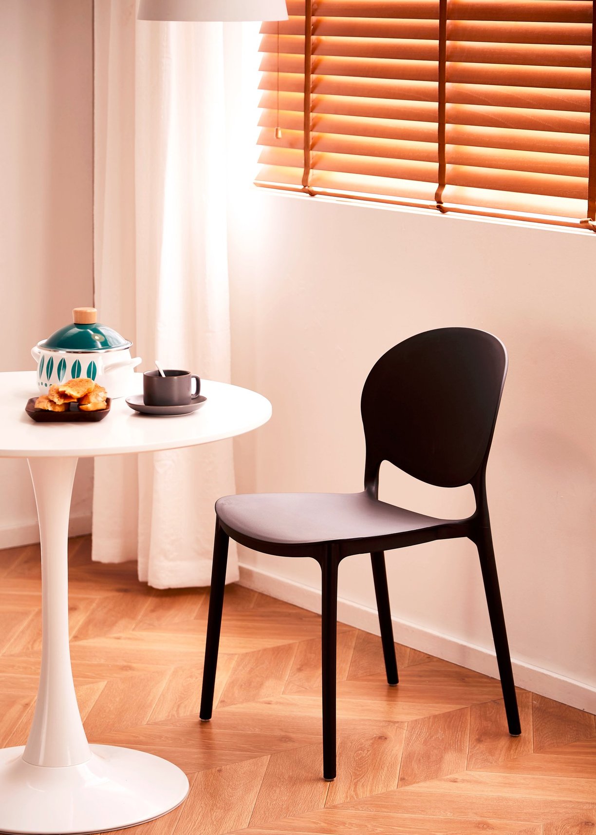 3D Renders of modern plastic chair set in a cozy, bright room with a wooden table, soft tones