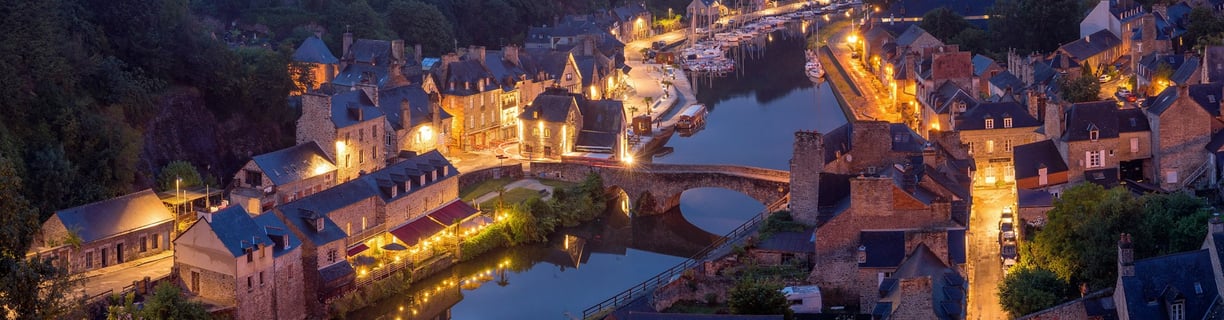 a cityscape of a river with a bridge and a bridge over it