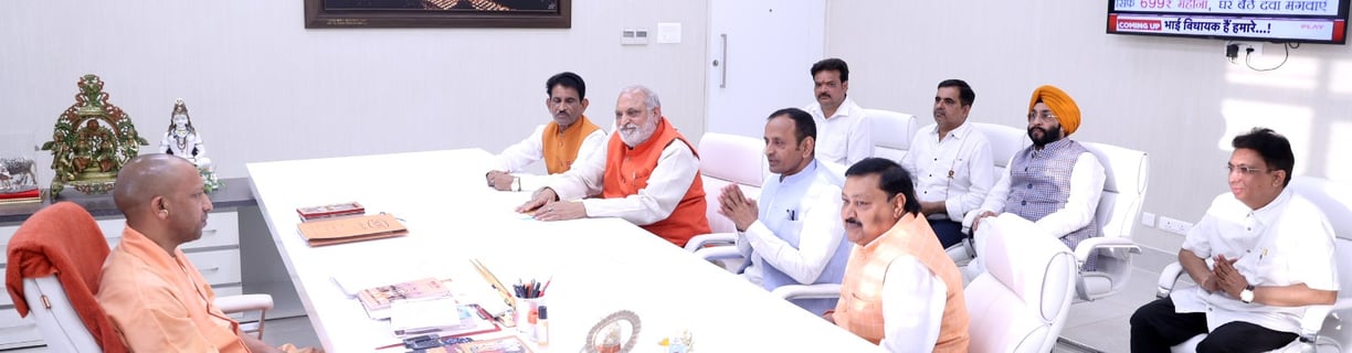 Natwar Goyal with Chief Minister of Uttar Pradesh Yogi Adityanath. Natwar Goyal Sitting infront of yogi Adityanath.