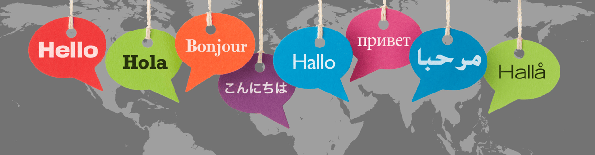 speech bubbles in different colours saying "hello" in different languages on a gray worldmap in the background