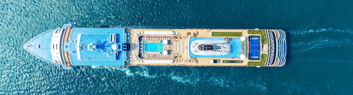 a large boat is traveling down the water