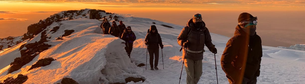 A group of Hybrid Trekkers walking to the summit of Kilimanjaro.
