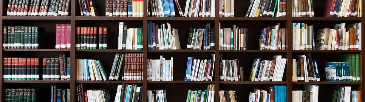 Bookshelf filled with books, symbolizing knowledge and healing resources