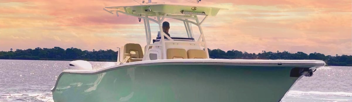 a man fishing on a boat in the water