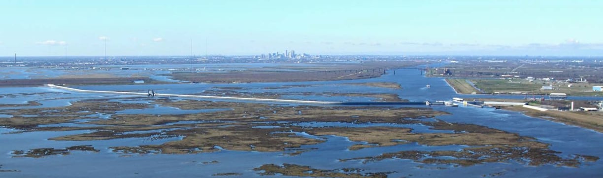 IHNC Lake Borgne Surge Barrier, New Orleans in background, 2013, image by U.S. Army Corps of Engineers