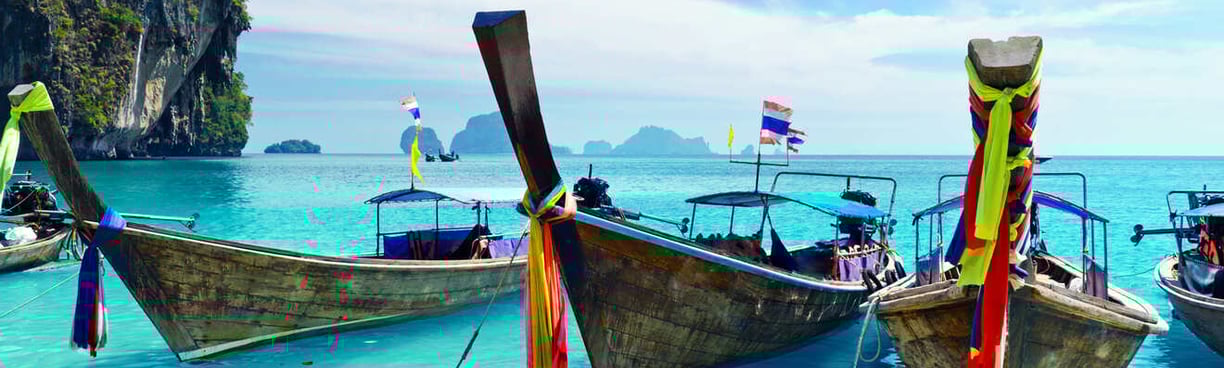 a number of boats on the water in phi phi island
