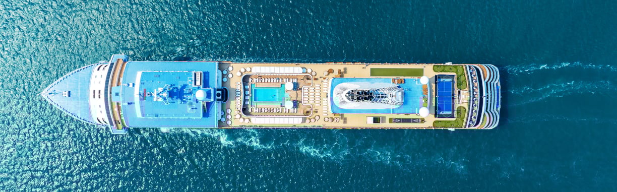 a large boat is traveling down the water
