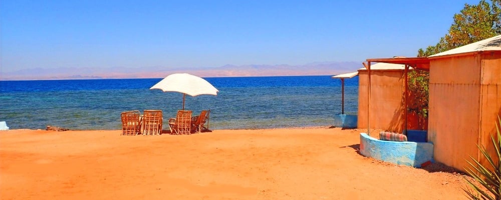 Bedouin star beach with chairs and umbrellas on the sand