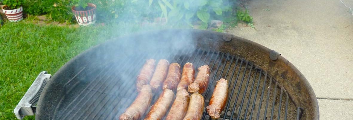 beautiful brats simmering away on the grill