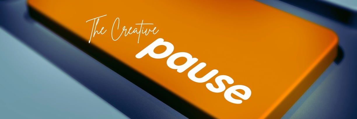 A photograph of a keyboard with the words "The Creative Pause" highlighting the importance of creative fine art photography
