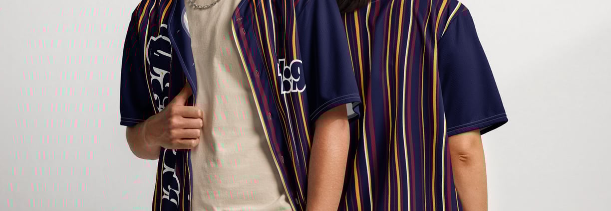a man and woman standing next to each other both showcasing YESHUA Apparel jerseys