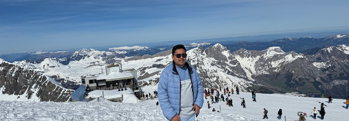a man standing on a snowy mountain top