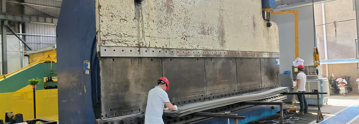 PMI Piping workers are bending alloy plate by bend machine