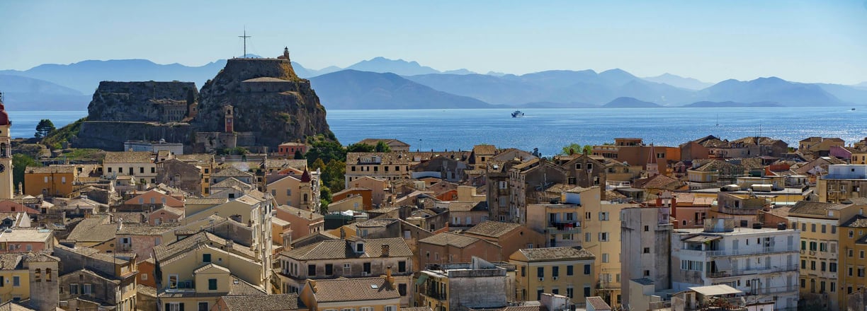 a cityscape of a large city with a view of the water