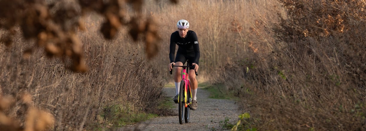 a man riding a bike down a path