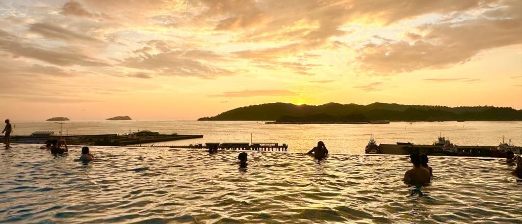 hotel swimming pool with sunset view
