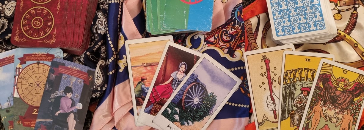 picture of 3 sets of tarot cards front and back