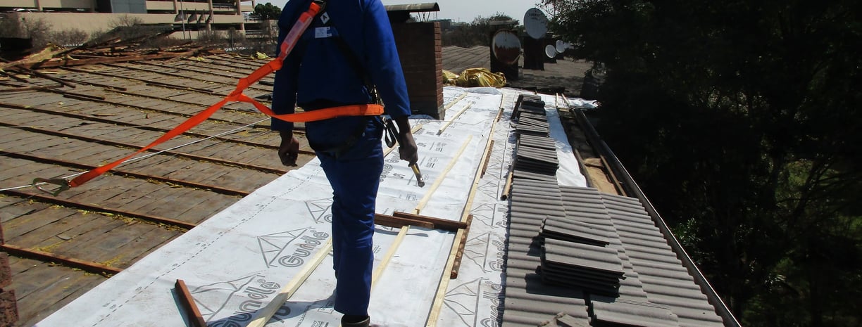 Staff safety harnessed to harness line, safety first, Hyde Park, Sandton