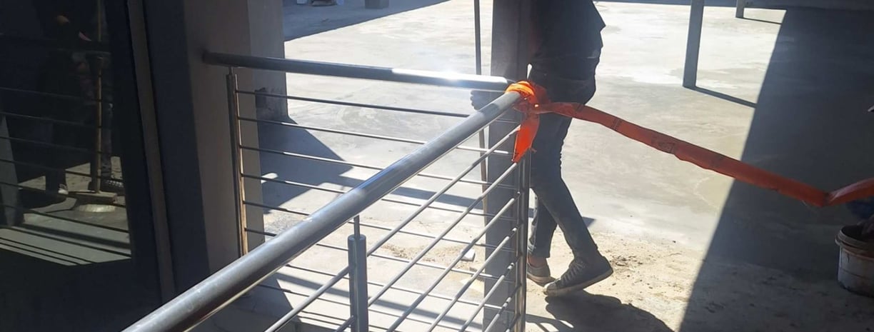 Ensuring clearing of fine debris after waterproof screed application, Harbor Bay Mall, Cape Town