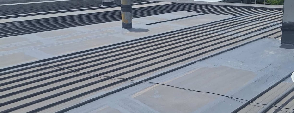 Advanced waterproofing procedures on metal IBR roof system, Lonehill Shopping Centre, Fourways