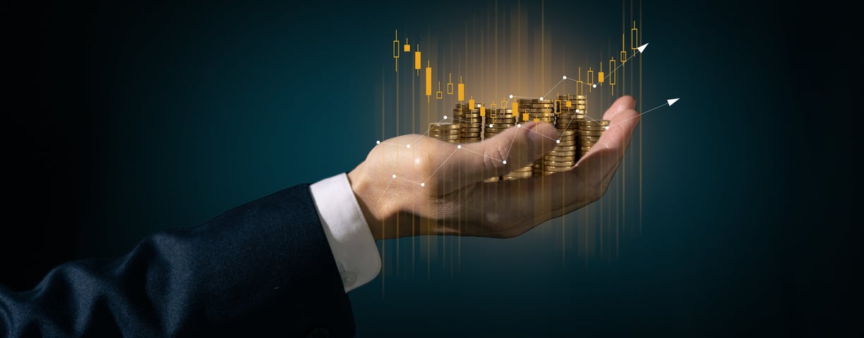 a person holding a stack of coins in their hands