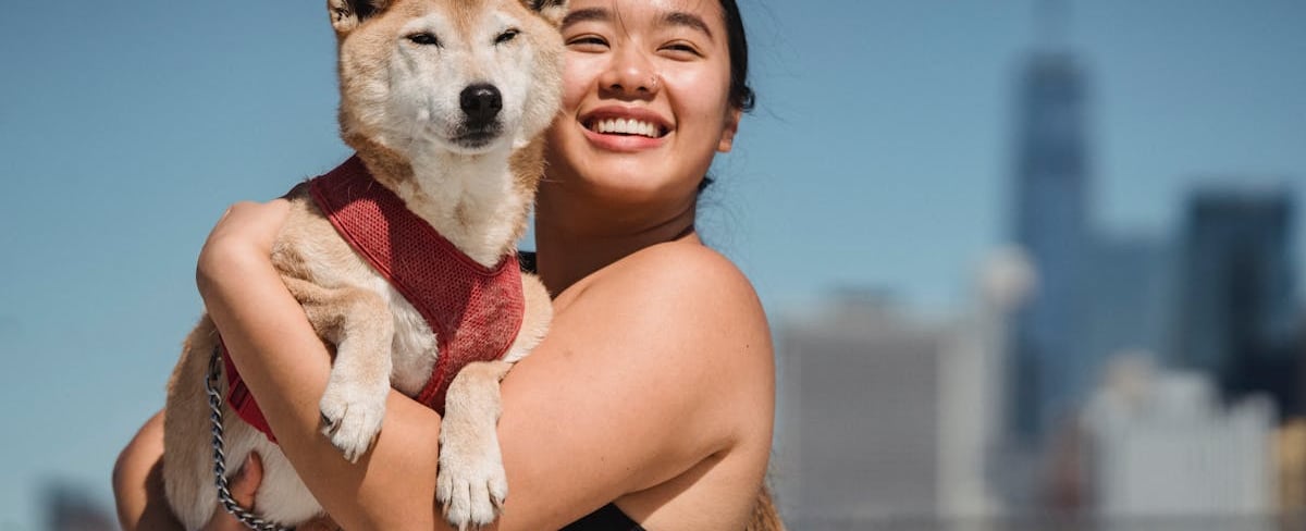 A woman cuddling her dog